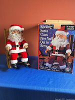 Animated Santa figure next to original box