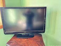 Front view of Sharp Aquos LCD TV on stand