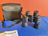 Binoculars front view with case and manual
