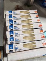 Stack of sealed Project Source 12-count wood shim packs