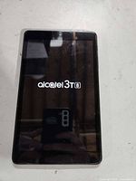 Front view powered on displaying Alcatel logo