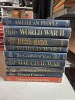 Spine view of all nine hardcover volumes