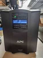 Front of APC Smart-UPS 1500 showing LCD display and branding