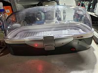 Front view of Bell+Howell VacuDome with dome closed showing latch and power indicator