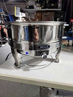 Front view showing BELLA logo, temperature knob, indicator light and legs