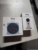 Boxed Blue by ADT keypad and doorbell camera on tabletop