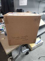 Full view of carton labeled "Shoe Covers Universal 100/pk"