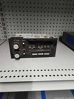 Front view showing faceplate, knobs, cassette slot and buttons