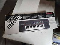 Front of retail box showing Casio SK-2 image and branding