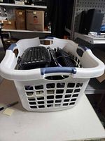 Basket with multiple keyboards visible from side