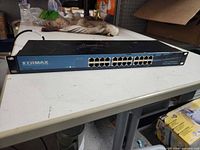 Front view showing Edimax branding, 24 RJ-45 ports, rack ears