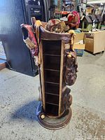 Full view of golf bag-shaped CD rack with shelves