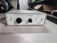 Front view showing brand, model, controls, and status LEDs