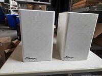 Front view of both Mirage M-90i white speakers with grilles