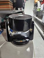 Side view displaying oscillating head and base