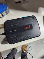 Top view of APC Back-UPS showing eight outlets and branding