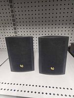 Front view of both Infinity speakers with grills