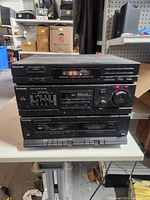 Front view showing CD player, tuner/equalizer section and dual cassette deck