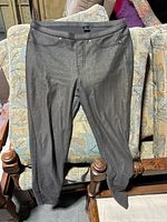 Metallic-finish HUE pull-on pant displayed on chair