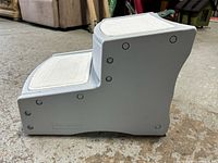 Side view of gray two-step plastic pet stairs