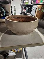 Front view of round glazed ceramic planter