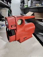 Front view showing gauge, handle, housing