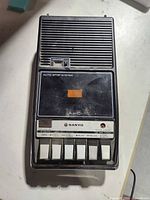 Top view of cassette recorder closed showing controls and speaker grill