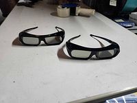 Two Sony active shutter 3D glasses on table front view