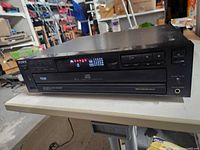 Front view showing controls, display and disc tray