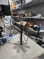 Full view of metal ornament tree with scroll branches