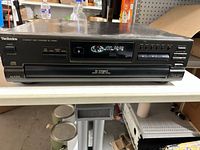 Front view of Technics SL-PD665 CD changer showing controls and display