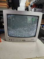 Front view powered on showing static on screen