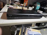 Front view of Toshiba SD-1800U DVD player on table