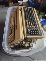 Top view of tote showing multiple beige keyboards, Gateway 2000 logo visible