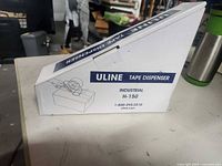 Closed retail box showing Uline Tape Dispenser Industrial H-150 labeling