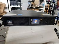 Front view of Vertiv Liebert GXT5 UPS showing vents, LCD panel, and controls