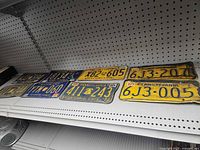 Shelf view of all eight plates showing general condition