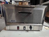 Front view of Wayne dry heat sterilizer showing logo, handle, controls