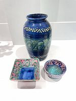 Front view of vase, square bowl and round bowl