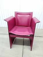 Front view of fuchsia leather armchair