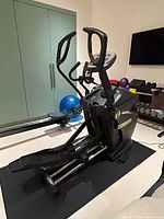 Front angled view showing overall elliptical trainer and frame