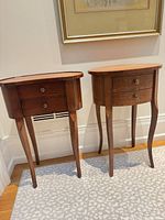 Two inlaid wood side tables side by side showing overall form, drawers, and legs