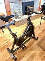 Full view of Schwinn Spinner bike on hardwood floor