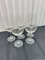 Five Spiegelau crystal wine glasses grouped together