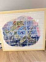 Frontal view of framed 36-tile fish art panel