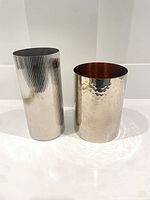 Both vases side by side showing exterior finishes and relative heights