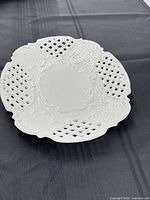 Overall view of white pierced porcelain platter