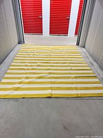 Full view of rug laid flat showing striped pattern and overall size