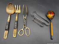Full view of all six utensils grouped on dark background