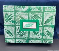 Closed gift box front showing branding and design